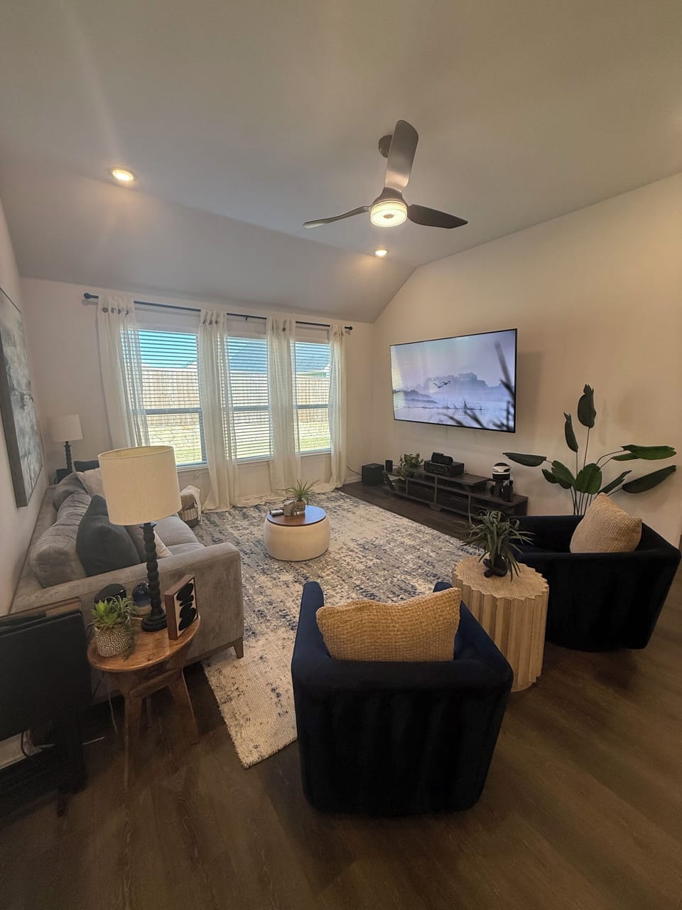 Living room with 85" TV, room for additional air queen sized mattress if needed
