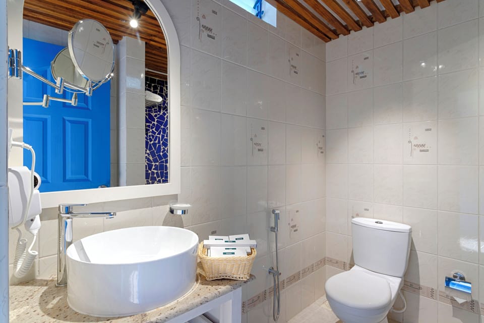 Deluxe Room, City View | Bathroom | Shower, slippers, soap, shampoo