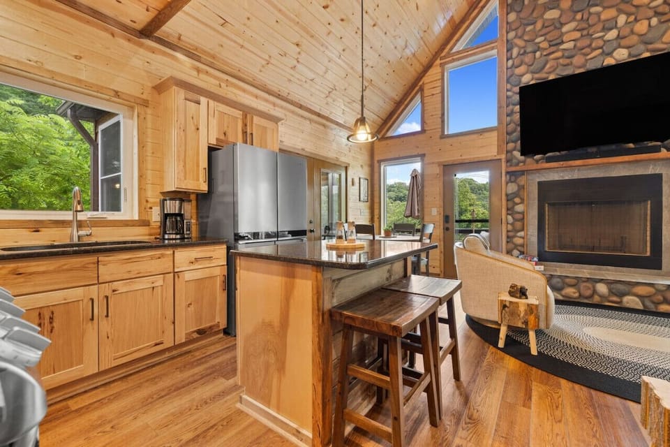 Cook up a storm in our fully equipped kitchen featuring a double oven, air fryer, kitchen island with bar seating, and all the essentials for your culinary adventures.