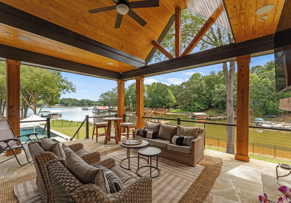 Outdoor porch perfect to use most seasons with seating and a TV. 