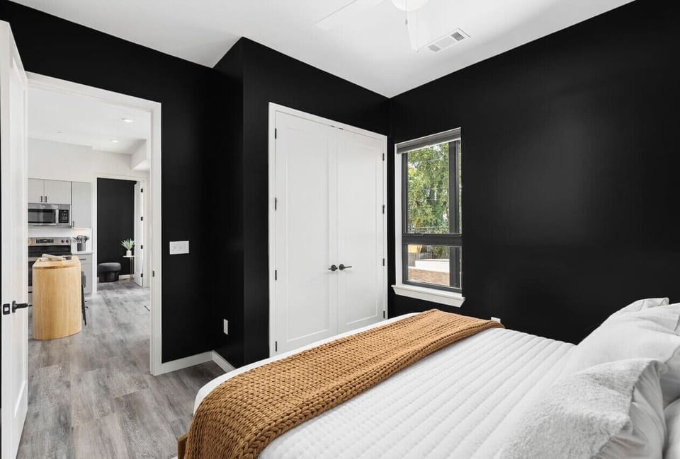 Comfortable King bed in the 1st bedroom with room-darkening shades, a large closet, and ensuite bathroom.