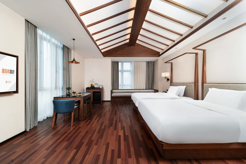 Signature Quadruple Room, 2 Queen Beds, Non Smoking | Down comforters, free minibar, desk, laptop workspace