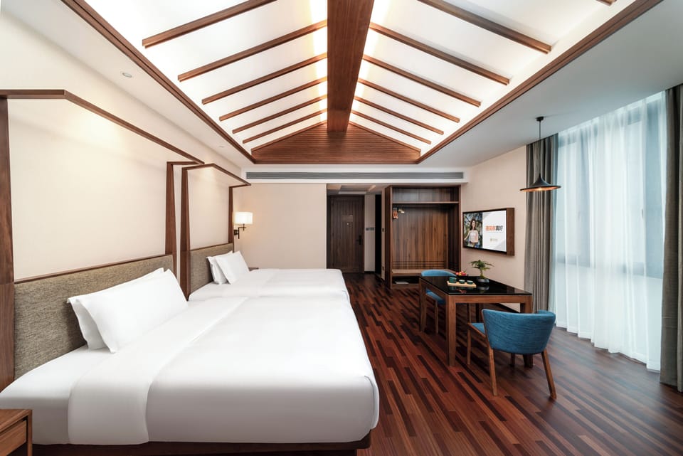 Signature Quadruple Room, 2 Queen Beds, Non Smoking | Down comforters, free minibar, desk, laptop workspace