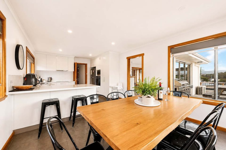 Main Dining & Kitchen
Generous dining area beside the main kitchen, providing plenty of space for everyone to enjoy meals together.
