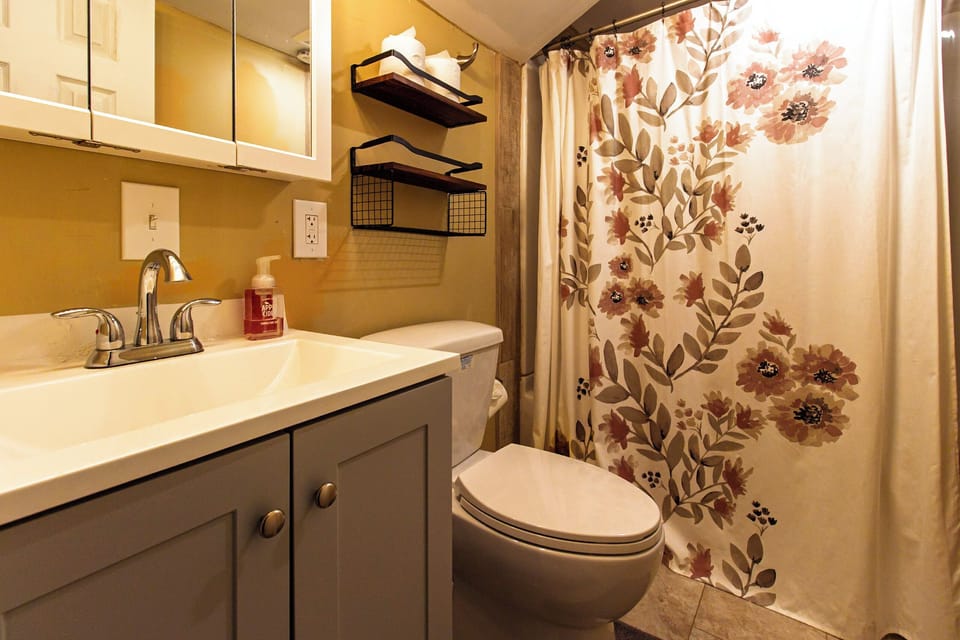 Full Bathroom with bathtub downstairs