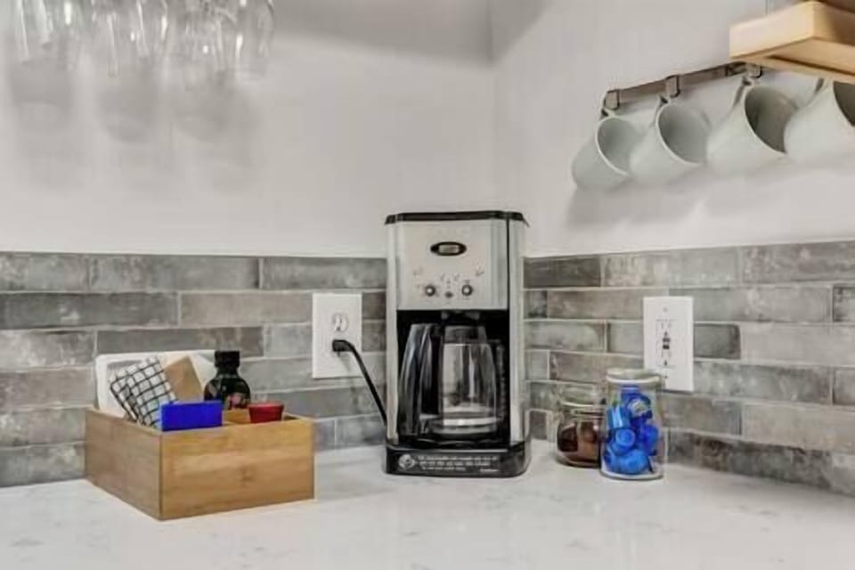 Coffee and tea set up with filters, coffee grounds, sugar and creamer