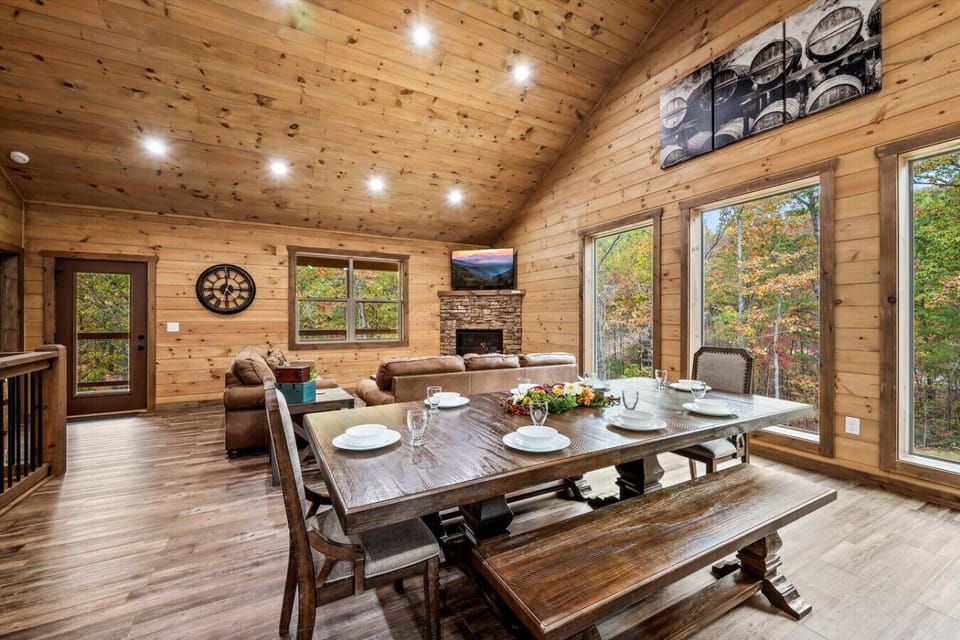 Enjoy a meal at the beautiful wood dining table, conveniently located between the kitchen and living room. The dining area also overlooks the private wooded yard.