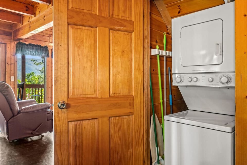 The laundry area is conveniently located just off the living room near the bedroom.