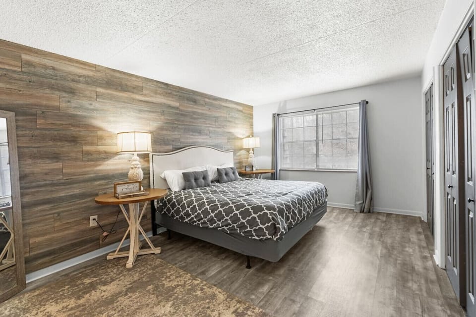 The large master bedroom includes a king bed and plenty of closet space for storage.