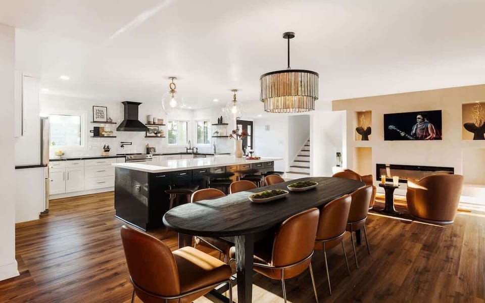 Formal dining area with seating for up to 8 and an accented bar area perfect for providing refreshments at the dinner table.