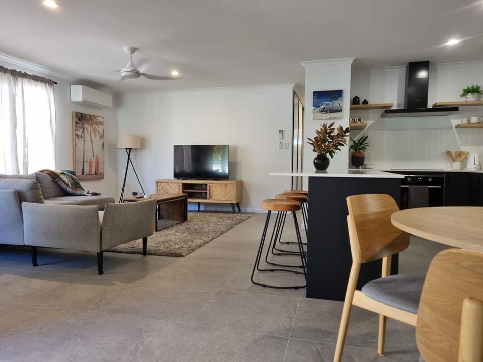 Open plan living room and combined dining and fully function modern kitchen.