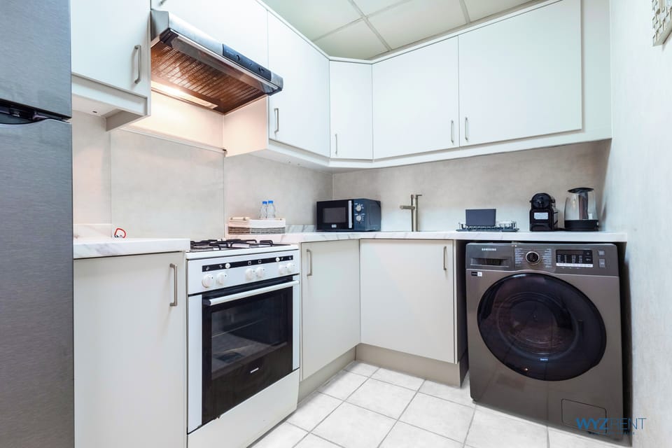 Comfort Apartment, City View | Private kitchen | Fridge, microwave, stovetop, dishwasher