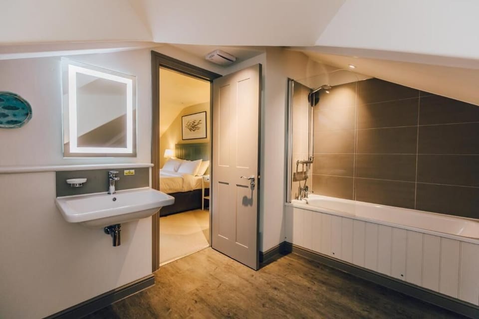 Shower, hair dryer, towels, toilet paper