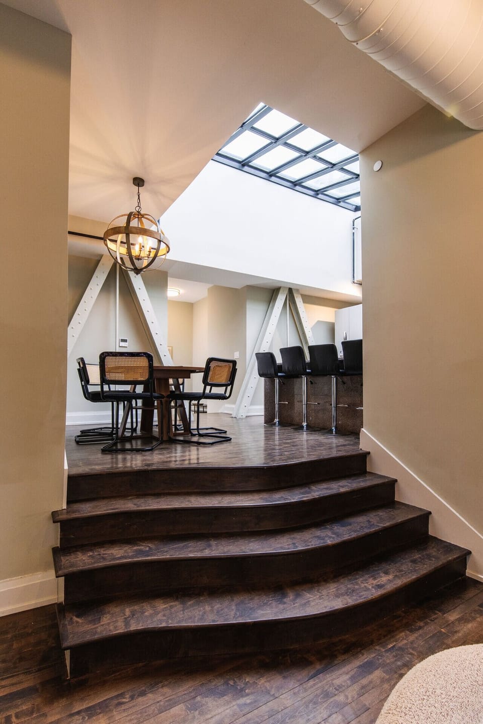 A dramatic skylight floods this penthouse with natural light, offering a unique perspective of the iconic clocktower above