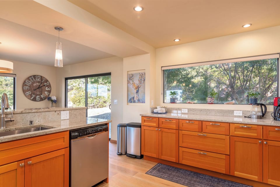 Full kitchen with kettle, coffee maker, toaster oven and more