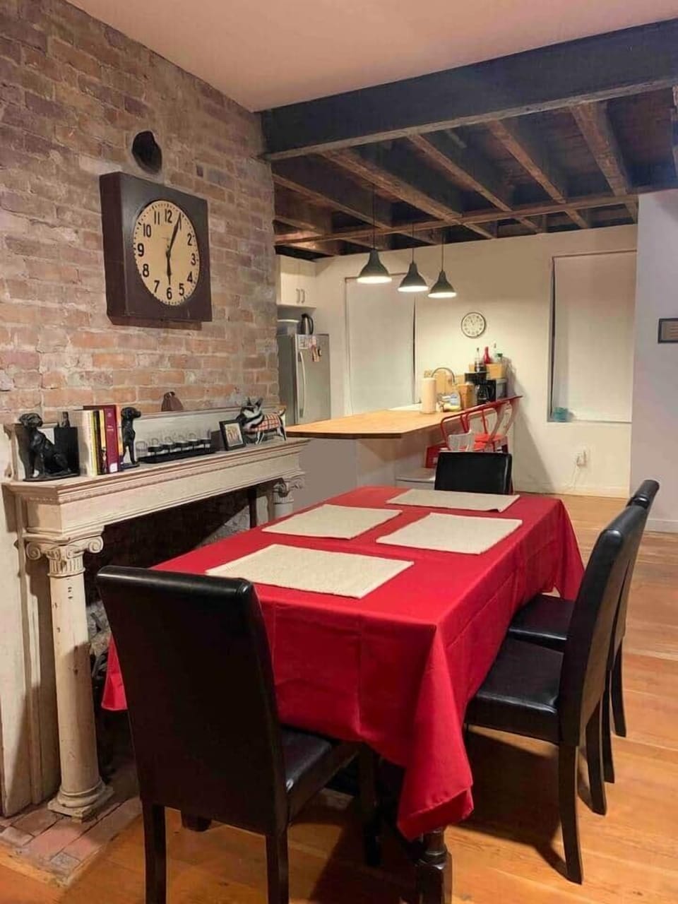 Dining room view looking toward kitchen, with a holida red tablecloth :)