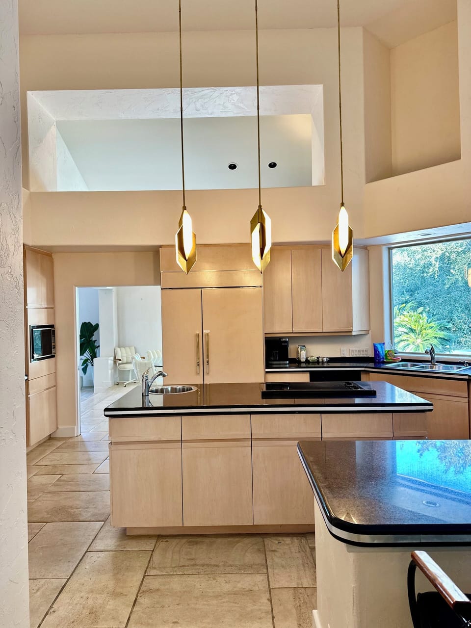 Kitchen island with Kelly Wearstler fixtures