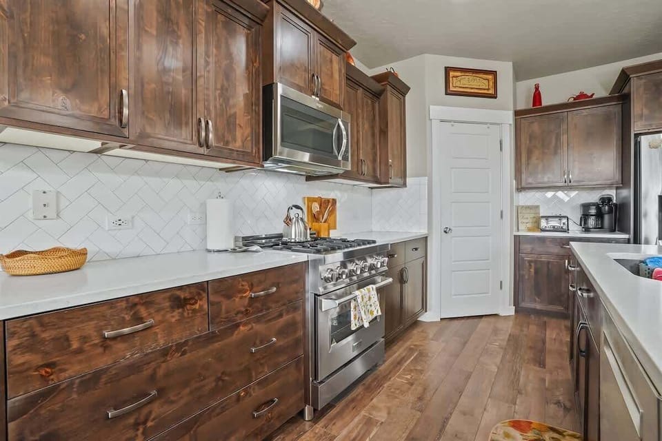 Fully stocked kitchen with large island for cooking and gathering