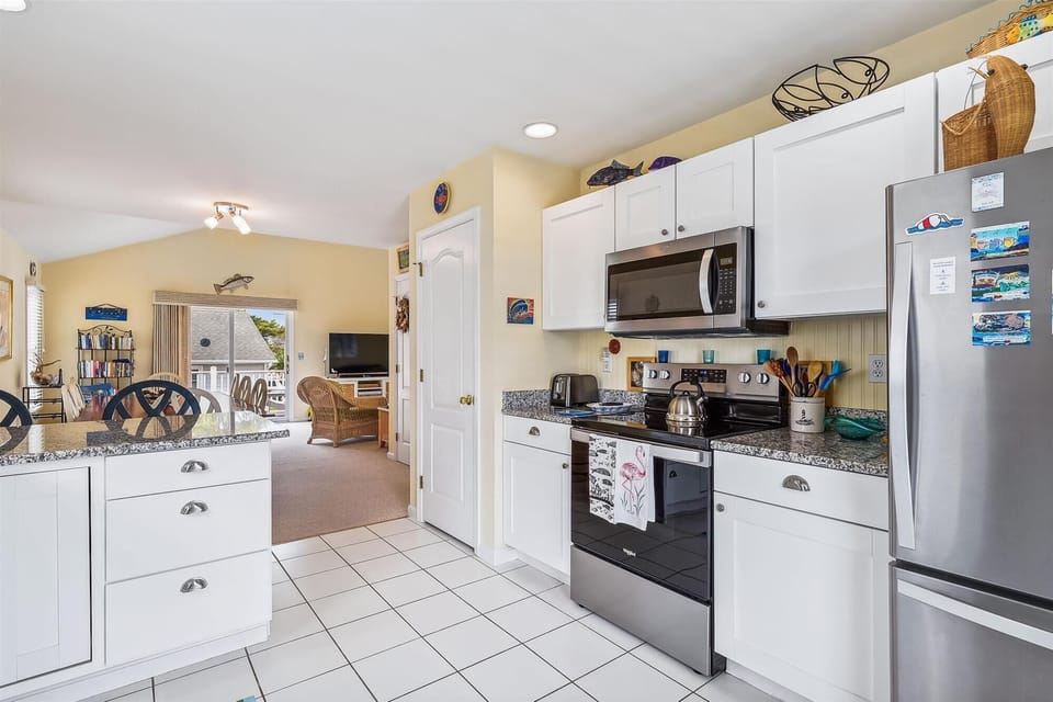 Your well-equipped kitchen features granite countertops, stainless appliances, and everything you need to prepare delicious meals during your stay.
