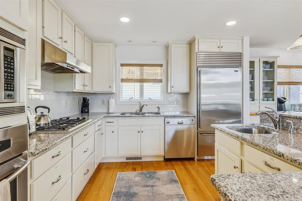 Whip up your favorite meals in this bright, fully equipped kitchen with granite counters, stainless appliances, and all the space you need to cook comfortably.