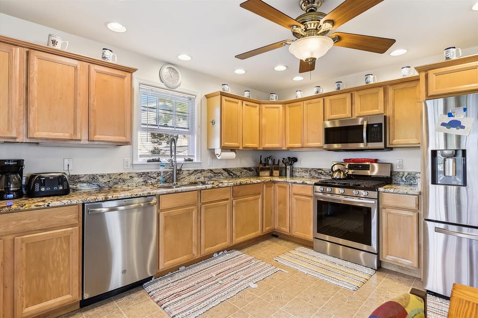 Picture yourself preparing meals in this fully equipped kitchen with granite countertops, stainless steel appliances, and warm wood cabinetry—everything you need to feel right at home during your stay.