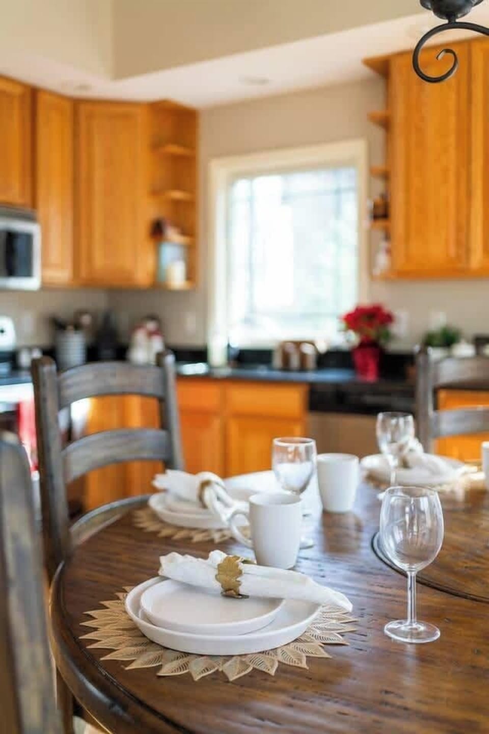 Plenty of dinnerware and wine glasses  for entertaining 