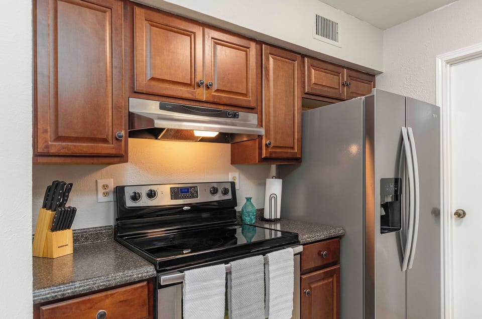 The kitchen has a toaster, blender, coffee pot, microwave, and all utensils.