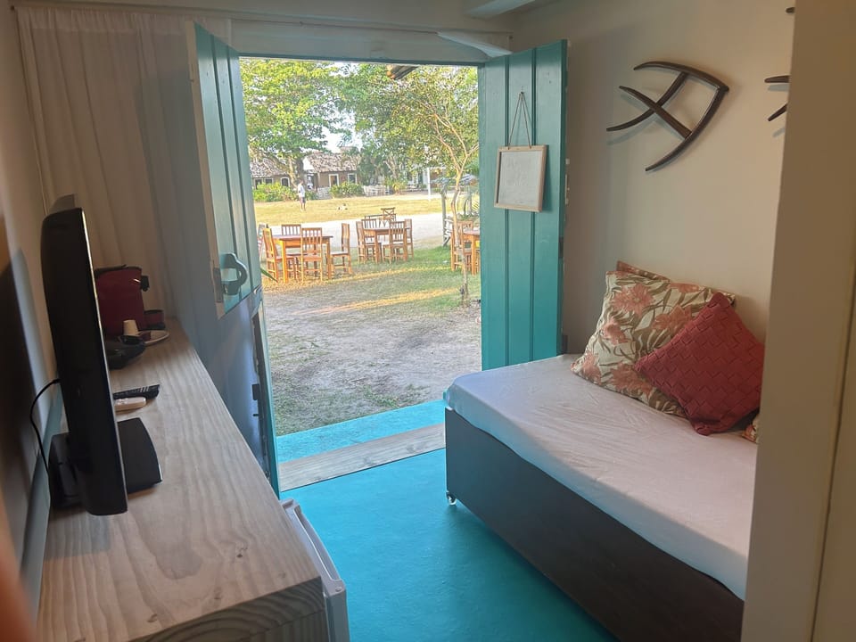 Premium Suite, Garden View | Living area | Flat-screen TV
