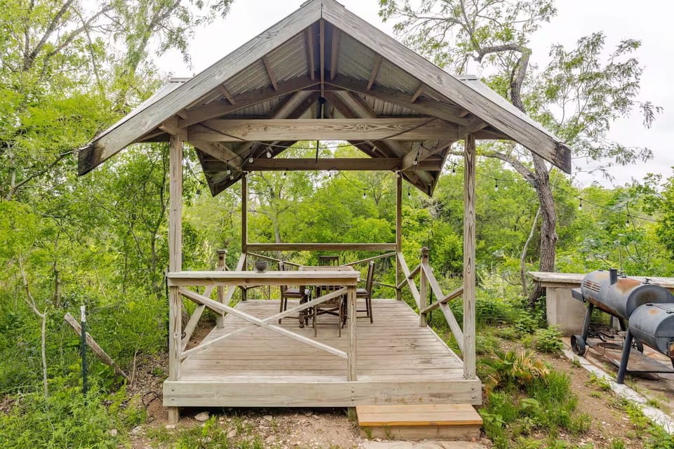 Relax under the pergola with seating for 8 and stunning San Marcos River views