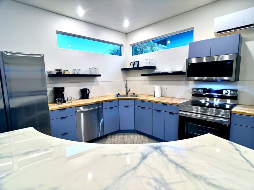 Modern design Kitchen with epoxy and wood countertops. Ask about our in home chef services.
