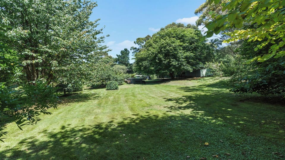 The property is on 1.25 acres of lush gardens