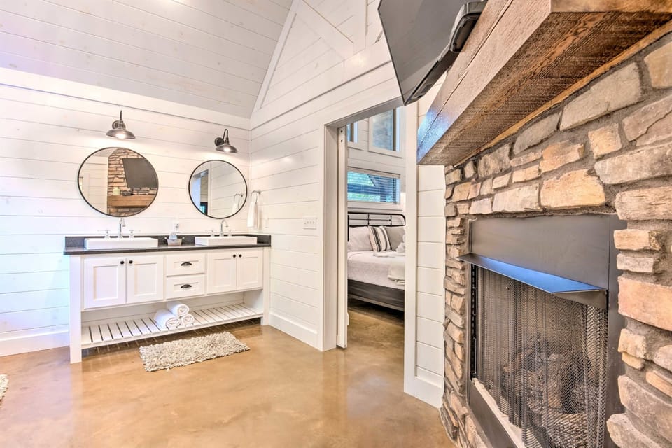 Master Bathroom: Dual vanities and a stunning stone fireplace for your ultimate relaxation!