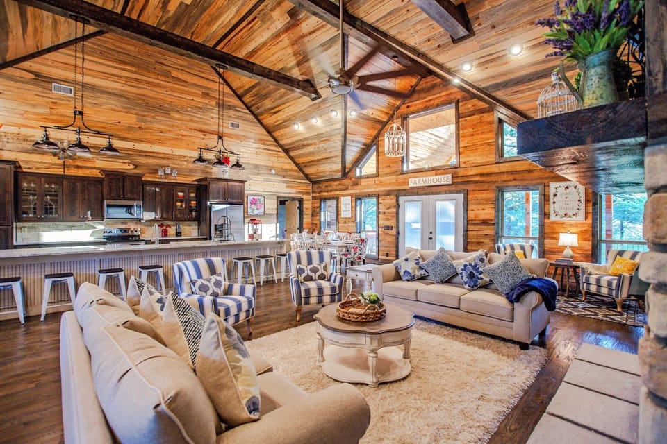 Living Room: Spacious retreat with rustic charm, abundant light, and trendy seating for gatherings!
