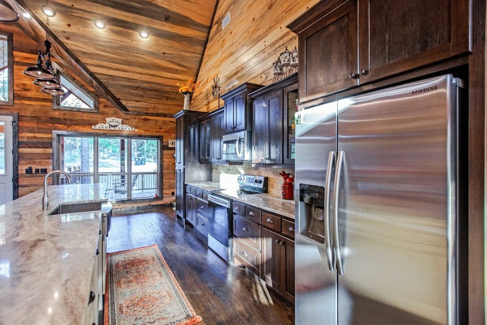 Kitchen: Unleash your culinary creativity in this stylish, sunlit kitchen with scenic views!