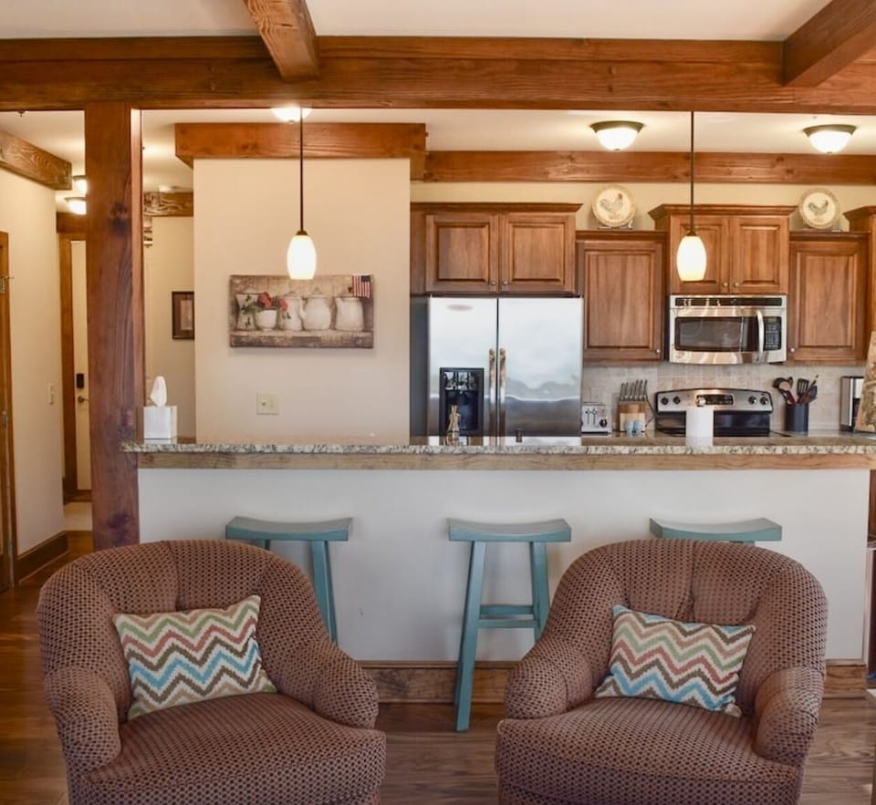 Family room/Kitchen with 3 bar stools