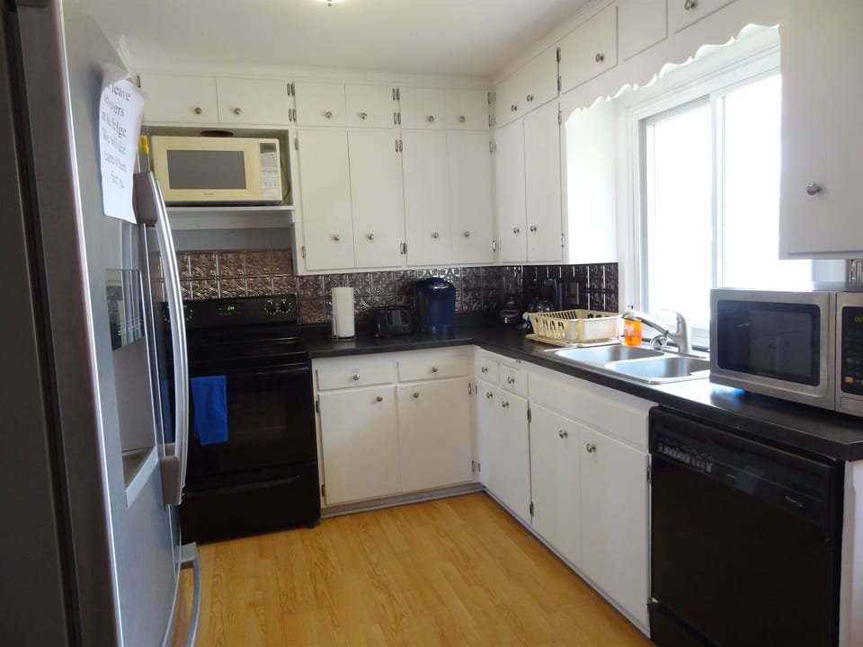 Kitchen with fridge, stove, dishwasher