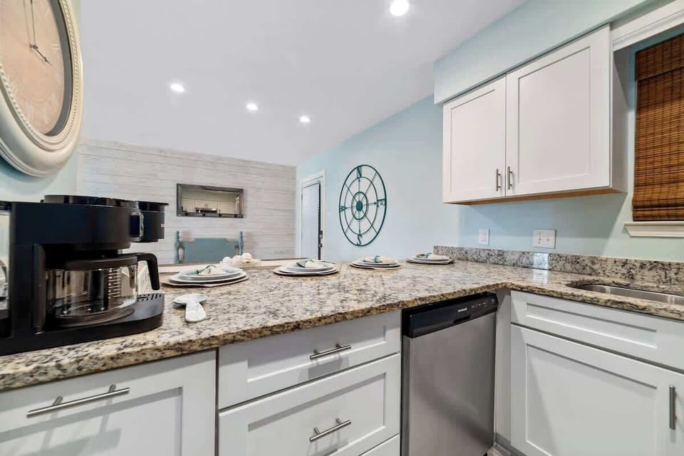 This fully stocked kitchen hosts a coffee bar with coffee, tea, and condiments.