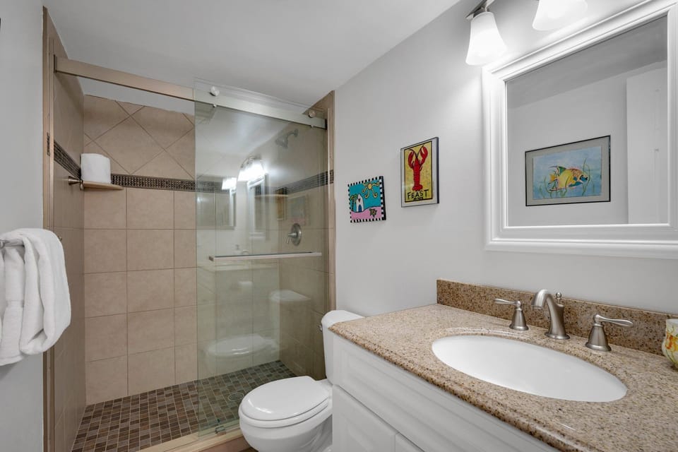 Guest bathroom with an updated glass and tile shower
