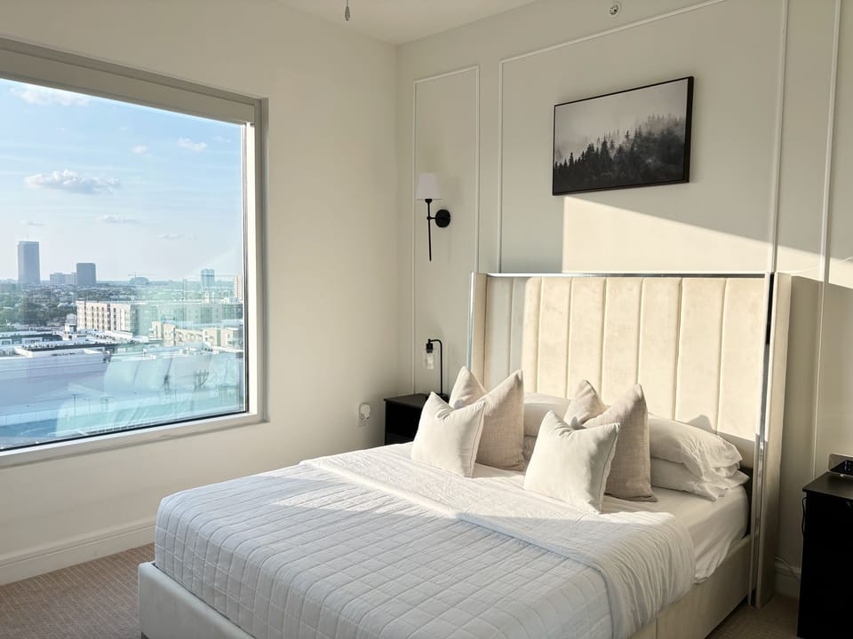 Bedroom with queen sized bed and 50" TV