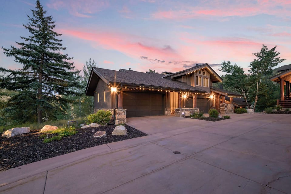 Exterior: View of front of the home, driveway with parking for 2 cars, garage with parking for 1 car