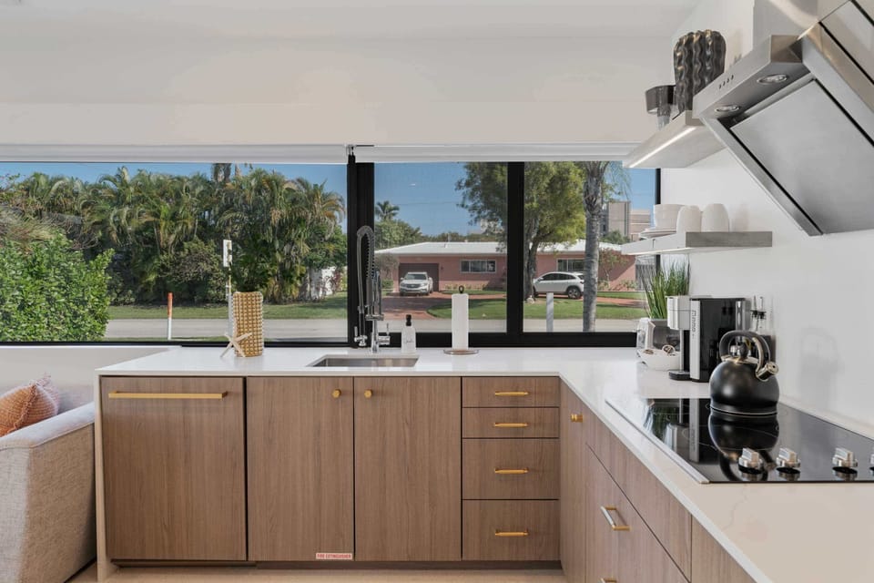 Studio: Enjoy cooking in a kitchen with expansive windows, where natural light pours in and provides a picturesque view to brighten your day.
