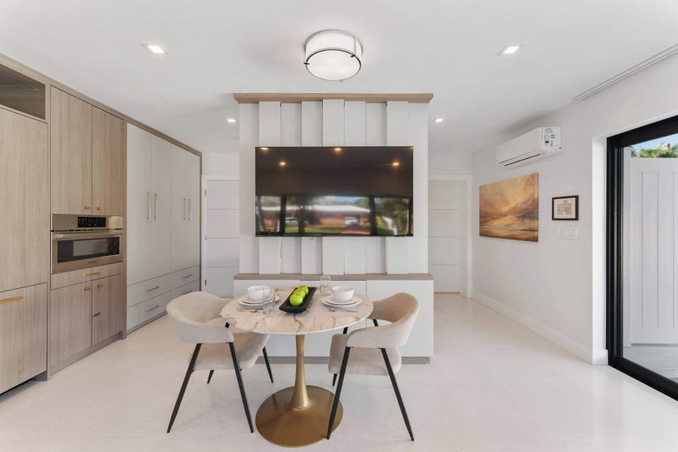 Dine for two in style, with a smart TV nearby for the perfect blend of dining and relaxation.