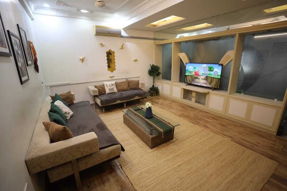 Luxury Apartment | Living area | Flat-screen TV