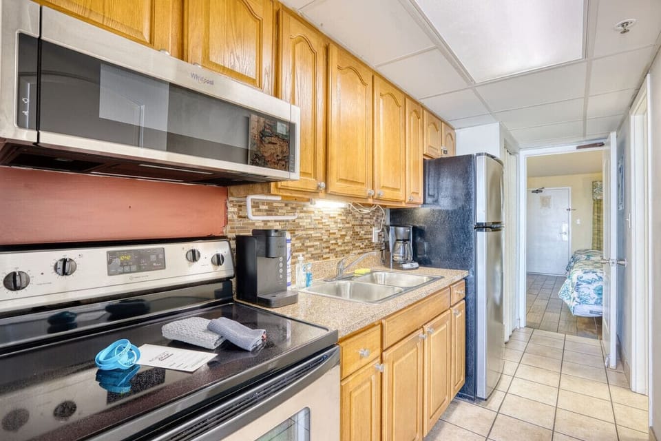 This fully stocked kitchen is perfect for the family cook or simply grabbing a snack. It comes equipped with an oven, stove, microwave, full-sized refrigerator, and both a K-cup and drip coffee maker and the essentials, including the kitchen sink!