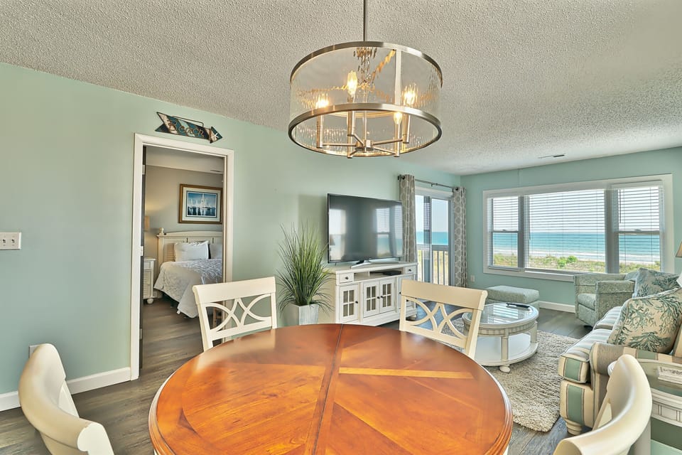Beautiful ocean view from kitchen area overlooking dining area and living room 