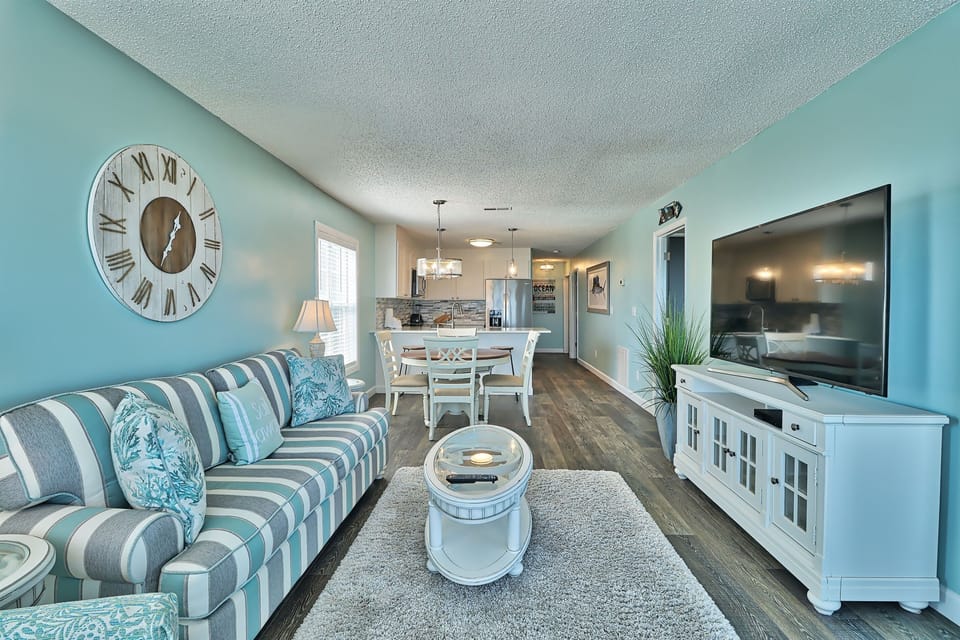 View of living room, dining area and kitchen