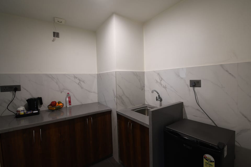 Deluxe Studio, City View | Private kitchen | Fridge, coffee/tea maker