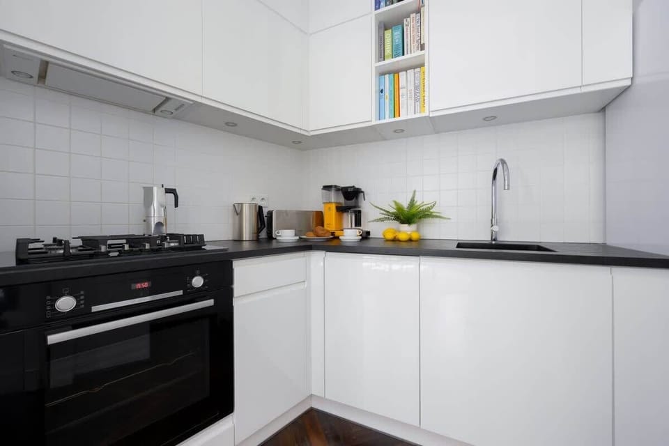 A functional kitchenette with an oven and hob allows for convenient meal preparation.