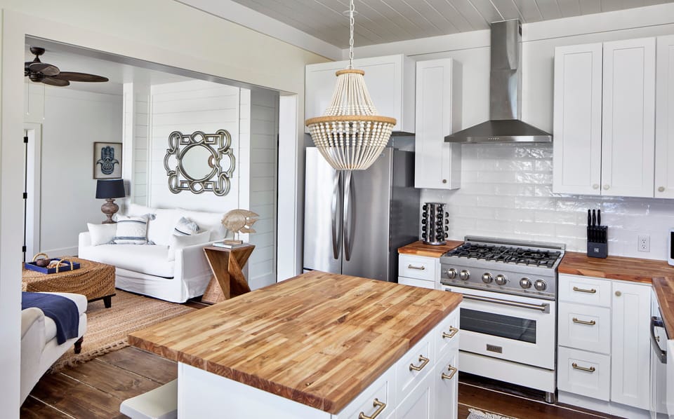 Fully equipped kitchen with island seating for two.