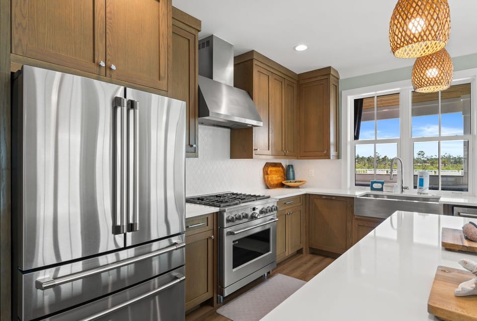 Your fully-equipped kitchen awaits with stainless appliances, gas range, and natural light flooding through the window—perfect for preparing meals with ease and style.